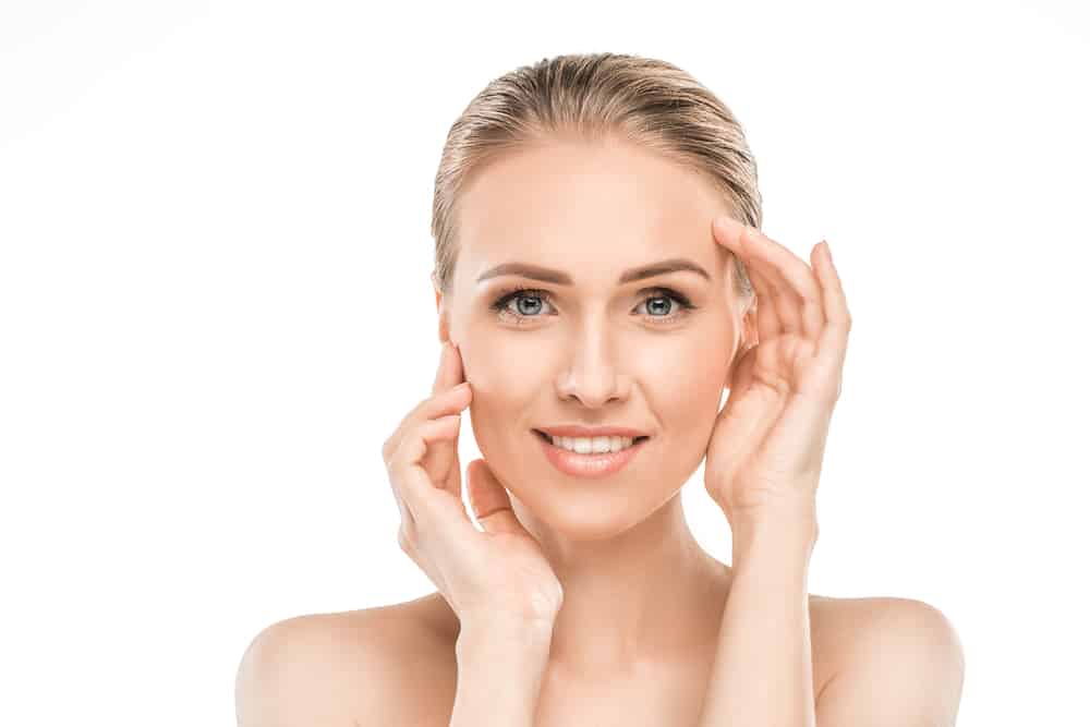 Woman with youthful facial contours and smooth skin showcasing facelift results.